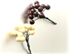 2 bundter med dekorations bær. Ø på det enkelte bær ca. 1 cm.